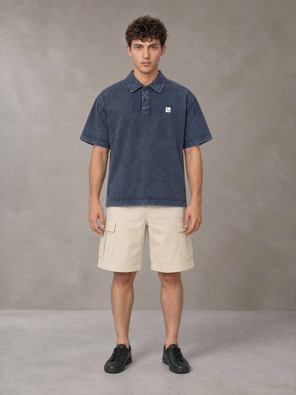 Model wearing SM Sig. Snow Washed Polo T-shirt in Oxford Navy, front view.