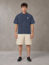 Model wearing SM Sig. Snow Washed Polo T-shirt in Oxford Navy, front view.