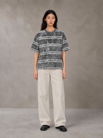 Model wearing SM Sig. Snow Washed Striped T-shirt in Pure Grey, front view.