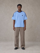 Model wearing SM Sig. Striped T-shirt in Blair Blue, front view.