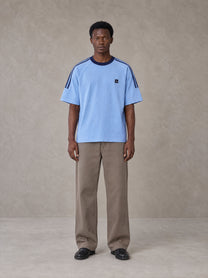 Model wearing SM Sig. Striped T-shirt in Blair Blue, front view.