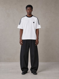 Model wearing SM Sig. Striped T-shirt in Lucent White, front view.