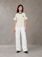 Model wearing SM Sig. Striped T-shirt in Natural Flax, front view.