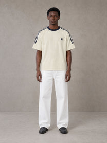 Model wearing SM Sig. Striped T-shirt in Natural Flax, front view.