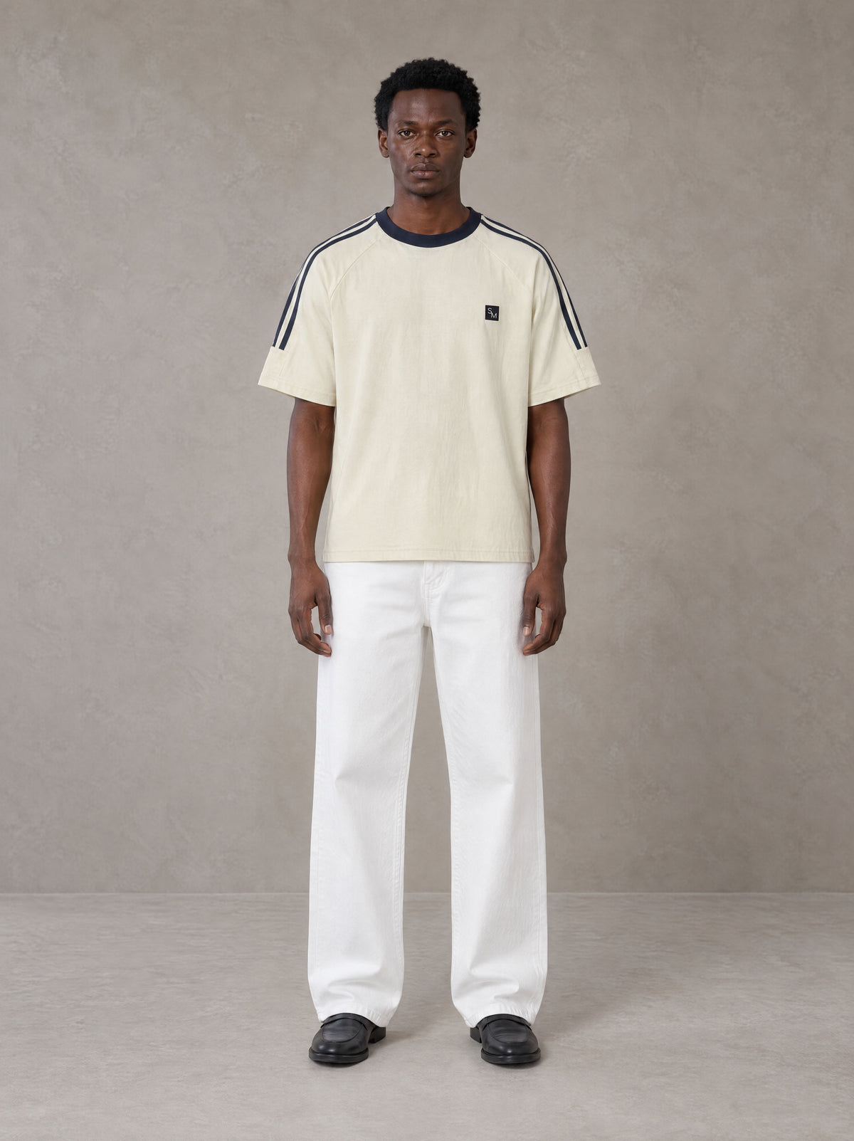 Model wearing SM Sig. Striped T-shirt in Natural Flax, front view.