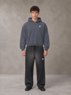 Model wearing SM Sig. Sunfade Boxy Hoodie in Chambray, front view.