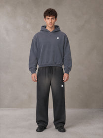 Model wearing SM Sig. Sunfade Boxy Hoodie in Chambray, front view.
