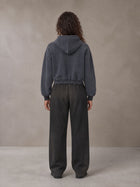Model wearing SM Sig. Sunfade Boxy Hoodie in Chambray, rear view.