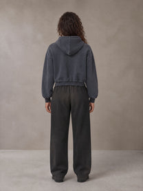 Model wearing SM Sig. Sunfade Boxy Hoodie in Chambray, rear view.