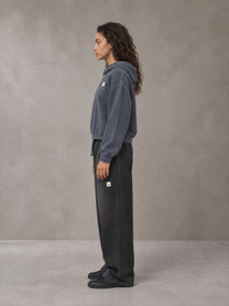 Model wearing SM Sig. Sunfade Boxy Hoodie in Chambray, side profile.