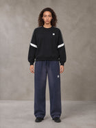 Model wearing SM Sig. Tempo Sweatshirt in Midnight Black, front view.