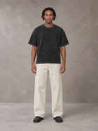 Model wearing SM Sig. Waffle Washed Boxy T-shirt in Midnight Black, front view.