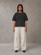 Model wearing SM Sig. Waffle Washed Boxy T-shirt in Midnight Black, front view.