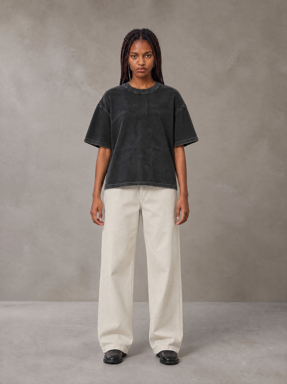 Model wearing SM Sig. Waffle Washed Boxy T-shirt in Midnight Black, front view.