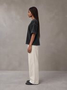 Model wearing SM Sig. Waffle Washed Boxy T-shirt in Midnight Black, side profile.