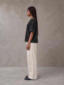 Model wearing SM Sig. Waffle Washed Boxy T-shirt in Midnight Black, side profile.