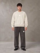 Model wearing SM Sunfade Fleeced Sweatshirt in Classic Cream, front view.