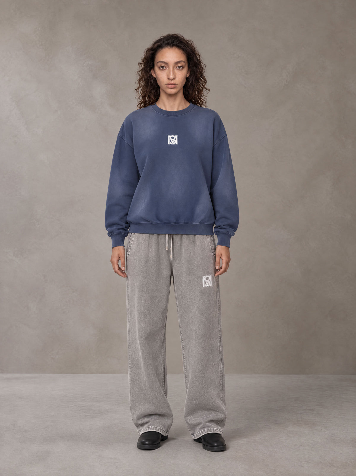 Model wearing SM Sunfade Fleeced Sweatshirt in Oxford Navy, front view.