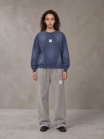 Model wearing SM Sunfade Fleeced Sweatshirt in Oxford Navy, front view.
