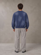 Model wearing SM Sunfade Fleeced Sweatshirt in Oxford Navy, rear view.
