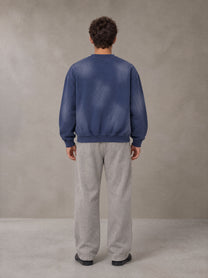 Model wearing SM Sunfade Fleeced Sweatshirt in Oxford Navy, rear view.