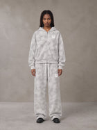 Model wearing the SM Cloud Fade Hoodie and SM Cloud Fade Sweatpants in Cloud Fade, front view.