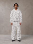 Model wearing the SM Cloud Fade Hoodie and SM Cloud Fade Sweatpants in Cloud Fade, front view.