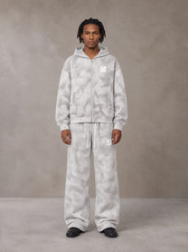 Model wearing the SM Cloud Fade Hoodie and SM Cloud Fade Sweatpants in Cloud Fade, front view.