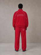 Model wearing the SM Fleur Eclipse Jacket and SM Fleur Eclipse Sweatpants in Crimson, rear view.