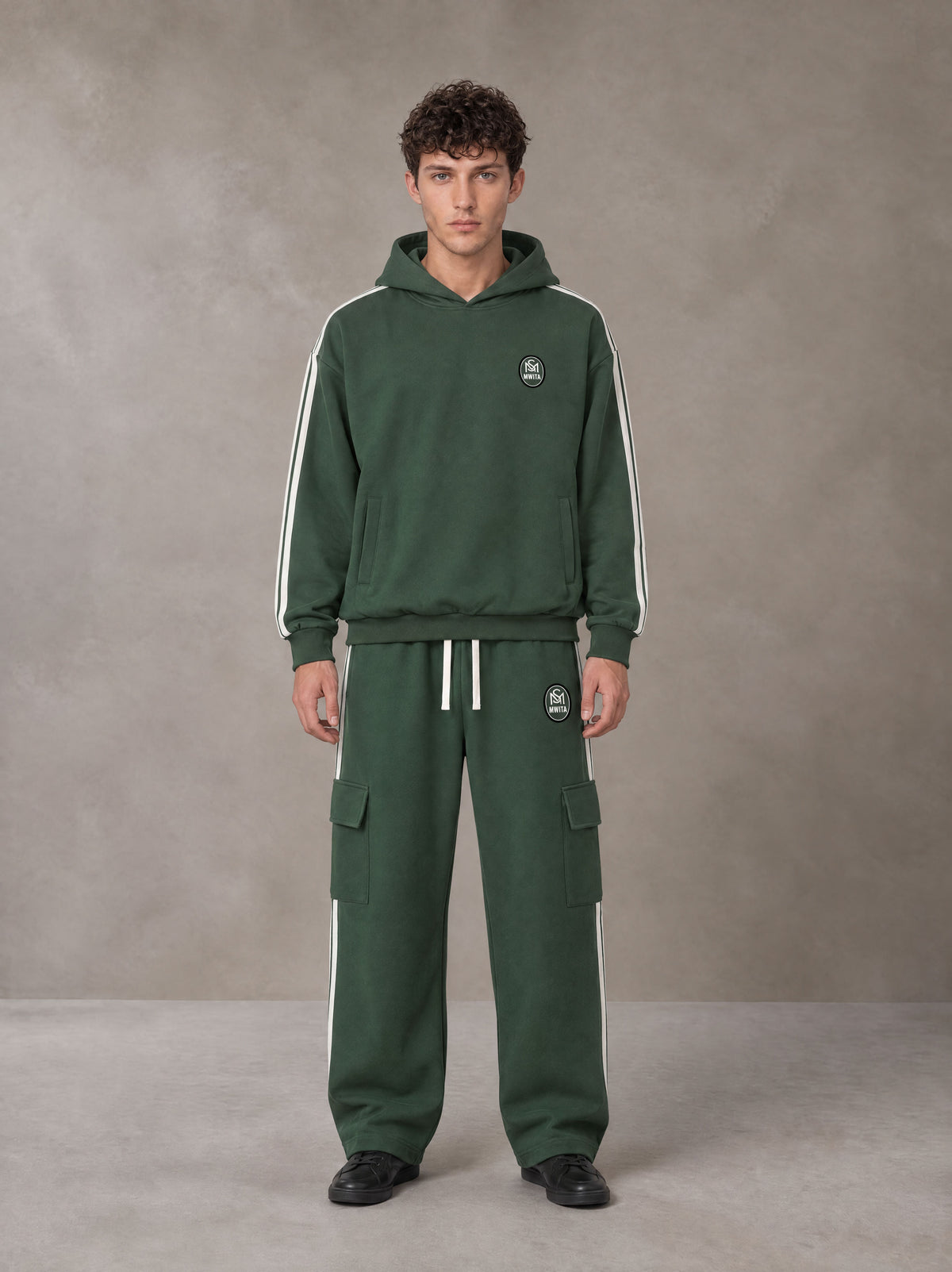 Model wearing the SM Insignia Utility Hoodie and SM Insignia Utility Sweatpants in Lunar Green, front view.