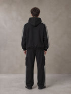 Model wearing the SM Insignia Utility Hoodie and SM Insignia Utility Sweatpants in Midnight Black, rear view.