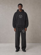 Model wearing the SM London Hoodie and SM London Sweatpants in Deep Charcoal, front view.