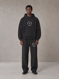 Model wearing the SM London Hoodie and SM London Sweatpants in Deep Charcoal, front view.