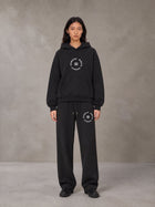 Model wearing the SM London Hoodie and SM London Sweatpants in Deep Charcoal, front view.