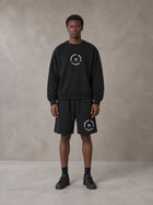 Model wearing the SM London Sweatshirt and SM London Shorts in Midnight Black, front view.