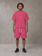 Model wearing the SM Echo Fleur T-shirt and SM Echo Fleur Shorts in Cherry Blush, front view.
