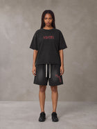 Model wearing the SM Echo Fleur T-shirt and SM Echo Fleur Shorts in Midnight Black, front view.