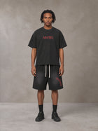 Model wearing the SM Echo Fleur T-shirt and SM Echo Fleur Shorts in Midnight Black, front view.