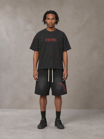 Model wearing the SM Echo Fleur T-shirt and SM Echo Fleur Shorts in Midnight Black, front view.