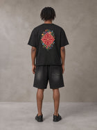 Model wearing the SM Echo Fleur T-shirt and SM Echo Fleur Shorts in Midnight Black, rear view.