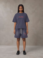 Model wearing the SM Echo Fleur T-shirt and SM Echo Fleur Shorts in Oxford Navy, front view.
