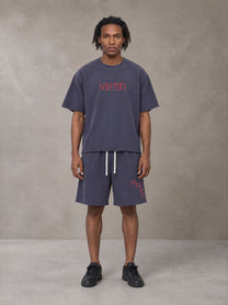 Model wearing the SM Echo Fleur T-shirt and SM Echo Fleur Shorts in Oxford Navy, front view.