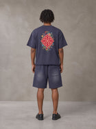 Model wearing the SM Echo Fleur T-shirt and SM Echo Fleur Shorts in Oxford Navy, rear view.