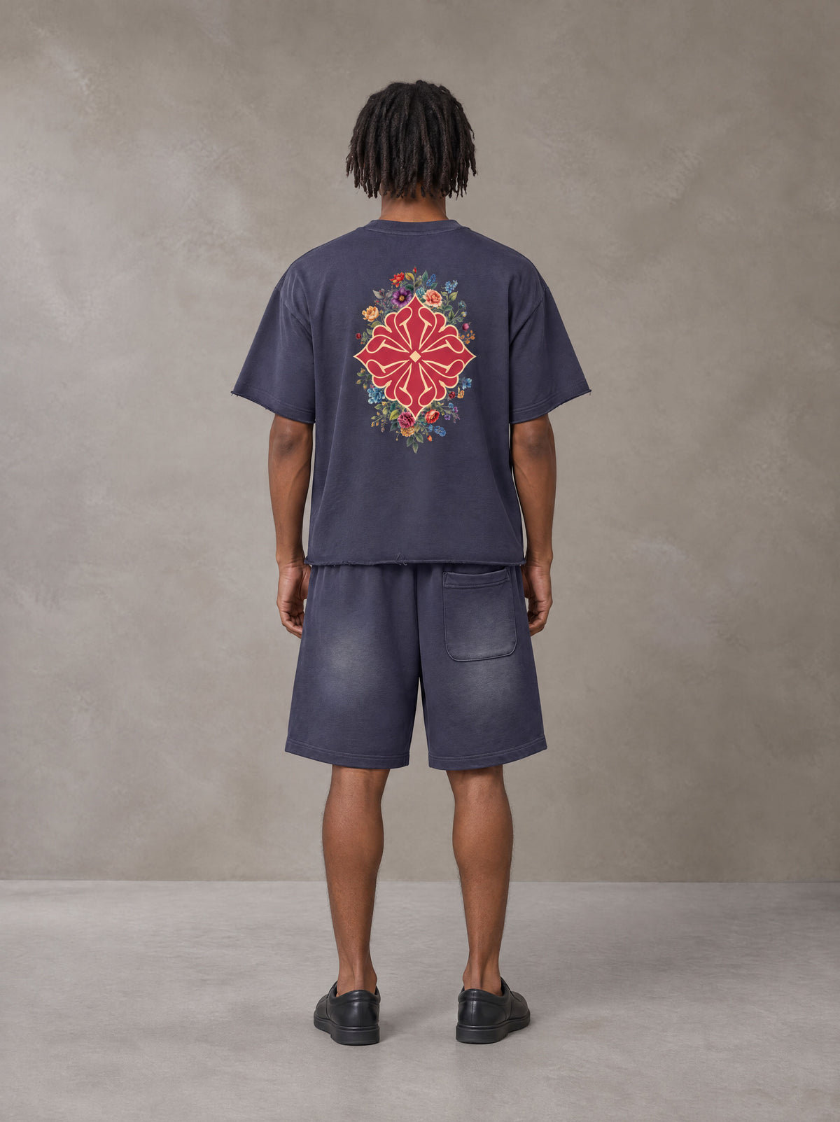 Model wearing the SM Echo Fleur T-shirt and SM Echo Fleur Shorts in Oxford Navy, rear view.