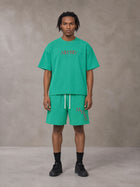 Model wearing the SM Echo Fleur T-shirt and SM Echo Fleur Shorts in Spring Shade, front view.