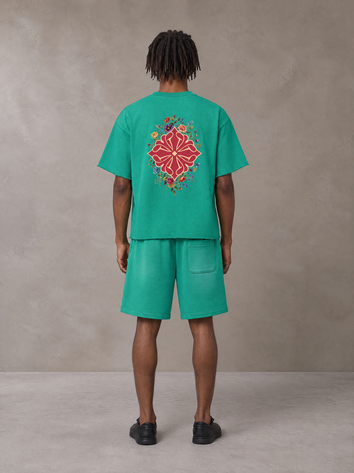 Model wearing the SM Echo Fleur T-shirt and SM Echo Fleur Shorts in Spring Shade, rear view.