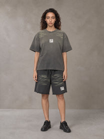 Model wearing the SM Vintage Washed T-shirt and SM Vintage Washed Shorts in Deep Charcoal, front view.