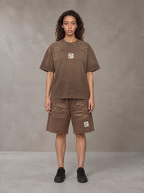 Model wearing the SM Vintage Washed T-shirt and SM Vintage Washed Shorts in Deep Coffee, front view.