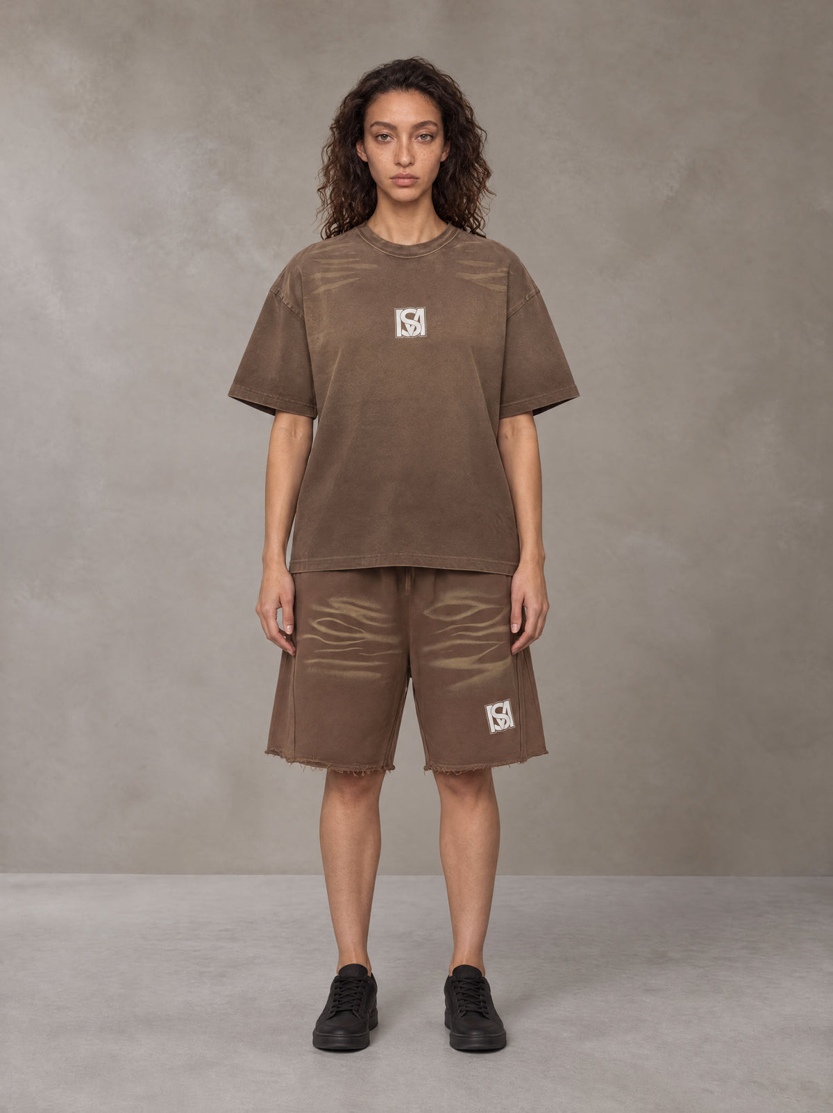 Model wearing the SM Vintage Washed T-shirt and SM Vintage Washed Shorts in Deep Coffee, front view.
