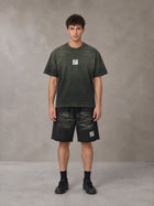Model wearing the SM Vintage Washed T-shirt and SM Vintage Washed Shorts in Midnight Black, front view.